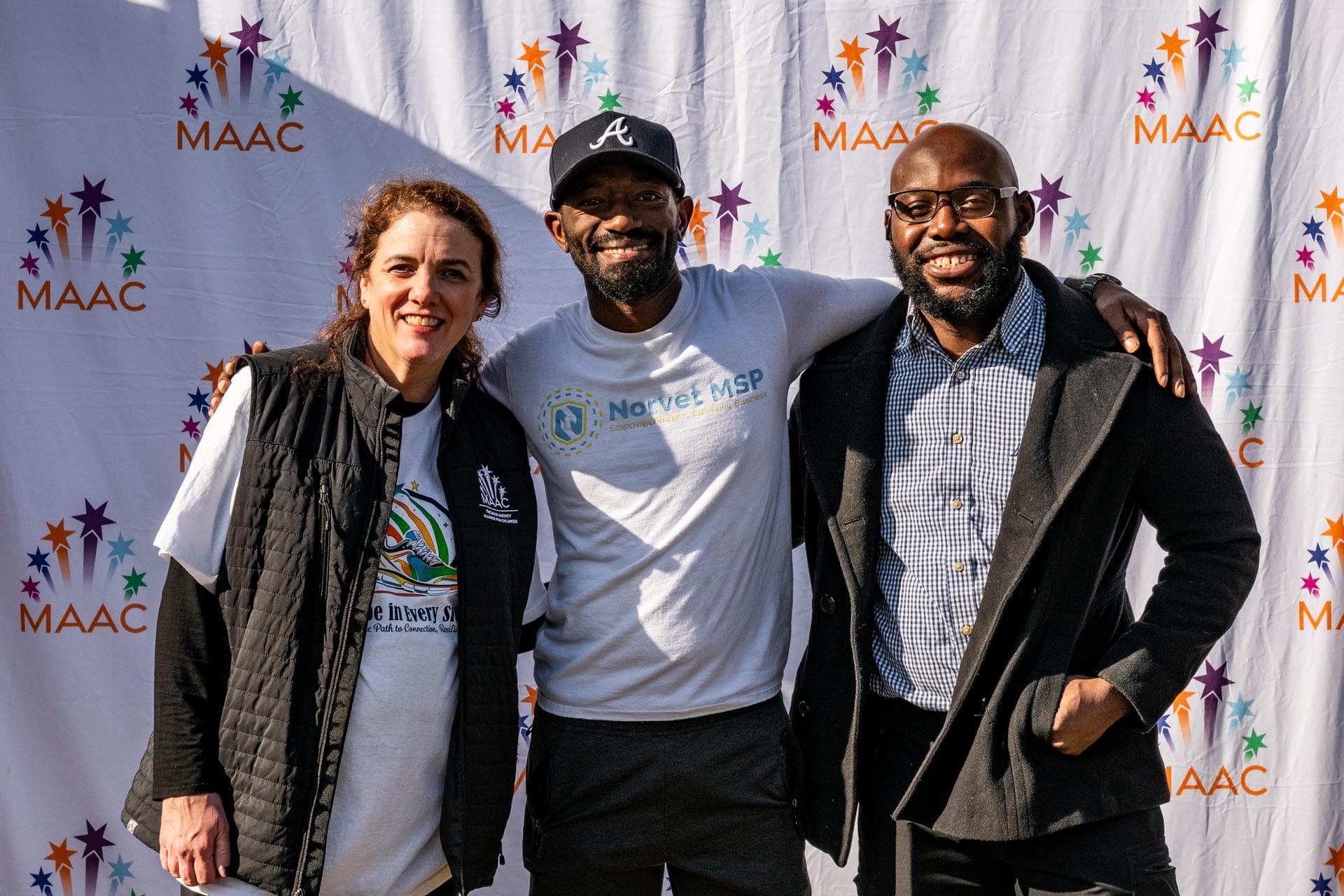 Gregory Rivers with MAAC team at a 2026 community event